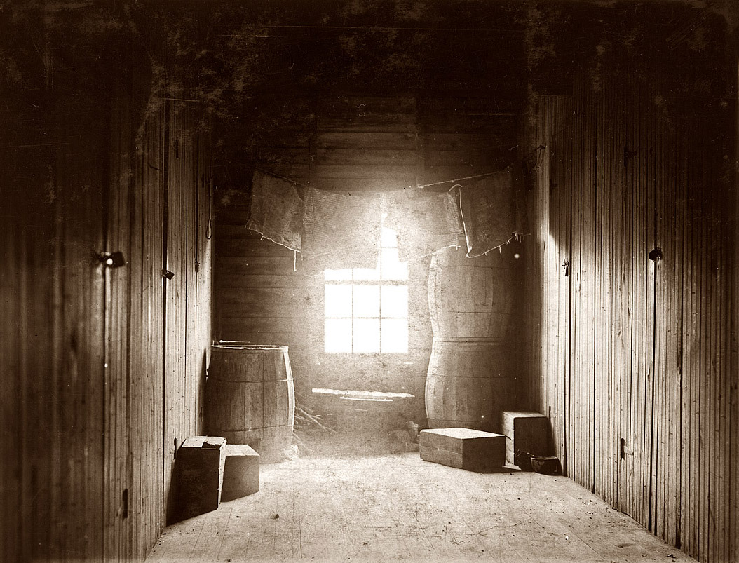 September 29, 1910. Upper-floor hallway opening onto 12 rooms in large shack occupied by cranberry pickers on Forsythe's Bog, Turkeytown, near Pemberton, New Jersey. View full size. Photograph by Lewis Wickes Hine.