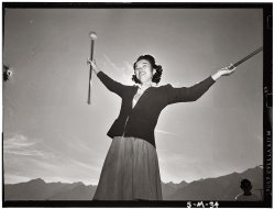 Florence Kuwata practicing with the batons at Manzanar Relocation Center, 1943. View full size. Photograph by Ansel Adams.