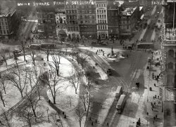 "Union Square from a skyscraper." Winter in New York 100 years ago. A little moldy but full of interesting details like the "Automatic Vaudeville" penny arcade and Brill Bros. store. 5x7 glass negative, George Grantham Bain. View full size.
Lesen Sie Deutsch?Lots of German and Jewish names on the signs here -- Gross, Brill, Strauss, Lapidus, Spang, Gottlieb, Heller, Nyburg, Stern, Mayer, Emrich, Schorsch, Spingler, Isaac ... did I miss any?
MetronomeIsn't this the location of the Metronome art installation and the Virgin store? I used to work 6 blocks south and walked by here every morning on my commute. Wish it still had corset stores instead of disturbingly fugly public art.
[The Metronome would be in the top left of the 1908 photo. - Dave]


14th StreetRe the Abbott photo, it is of a different street -- Barnes &amp; Noble is on 17th (Union Square North). The Automatic Vaudeville Building (the Bain photo) was at 46 East 14th Street (Union Square South), next door to a Whole Foods market now. The only microbrewery  that I know of in this area, Heartland Brewery, is on Union Square West. The Bain photo shows Union Square South (14th Street). The Automatic Vaudeville company, started by Adolph Zucker, founder of  Paramount Pictures, was taken over by Marcus Loew. This was the start of the movie industry as we know it.
Childs RestaurantThe Childs Restaurant on the south side of East 14th Street brings back some fond memories of the one on the north side of East 42nd between Madison and Vanderbilt. My family always stopped there for a meal after coming down on the NY Central train from Beacon. My grandmother's much younger half-brother was a close friend of the Childs family, who maintained a large country place in rural northern New Jersey back in the first third of the 20th century. He also spent some time back then working as a kitchen chef for one of their NY City restaurants.
Park benchesYou don't see park benches strung along pathways anymore.  These days they plop them down so they are separated by as much space as possible.  It was much more communal back then.
Some things don&#039;t really changeThis part of New York has changed very little. Almost every building visible in this photo remains. I believe that the tall one to the right is a Barnes &amp; Noble and the "Automatic Vaudeville" is now a microbrewery.
Berenice Abbott took a famous photo of these buildings from street level in the 1938.

Perhaps some day team Shorpy will provide a better version for us.
[They all look different to me. Plus there are seven buildings across in the Bain photo, and six across in Berenice's. - Dave]

14th Street and University Place
It appears to be a view looking south along University Place. Here is a great page from the 1911 New York Times.
Union Square RevisitedOops, of course this is Union Square South. The other three sides of Union Square remain largely unchanged since the late 19th century, but much of the southern border of the square is new.
Union Square CondosThere is massive construction of condominium residences occurring right now on Union Square West between 14th &amp; 17th Streets. Their timing is a little off, but don't feel too sorry for them. Anything in Manhattan that overlooks parks, landmarks or rivers will always be in demand.
Union SquareThis view is of the west side of the park from 15th street to 16th street. I believe one or two of the center building are still there although their facades have been changed. The photo was probably taken from a turn of the century building opposite on the east side of Union Square which is still standing.
[Not quite. The view is of the south (14th Street) side of the park, with Broadway on the left and University Place on the right. - Dave]

Re: Park BenchesThe park benches in Union Square Park (which I assume are not the benches pictured here) are very much in the same winding pattern along the walkways.  There are even little semicircular nooks of benches where people (myself included) can chill out with a larger group and have a nice chat.
Dead Man&#039;s Curve!The Southwest corner of Union Square, so well documented in the photograph, was in the 1890s the scene of many pedestrian accidents as the street railways, then cable cars, would whip around the fast curves in order to maintain momentum through these curves and not become stranded. This fast maneuver was the cause of the accidents and this busy corner became known as Dead Man's Curve, long before Jan and Dean raced that XKE to disaster in their Stingray.
(The Gallery, G.G. Bain, NYC)