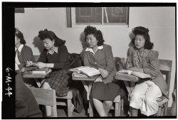 Kiyo Yoshida, Lillian Watkatsuki and Yoshiko Yamasaki in their high school biology class at Manzanar, 1943. View full size. Photograph by Ansel Adams.