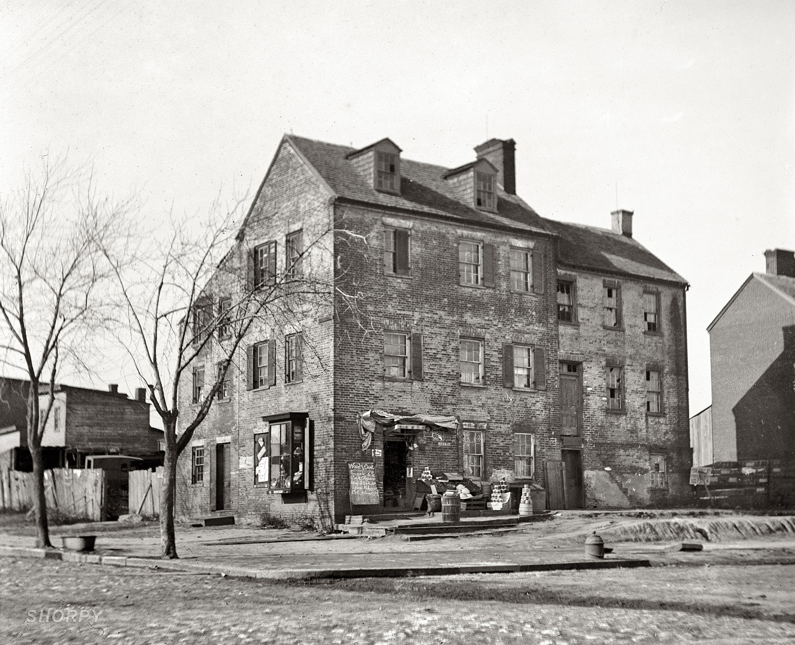 Next in National Photo's "old house" series from circa 1918: "Old house, 1st & N Street N.E." National Photo Company Collection glass negative. View full size.