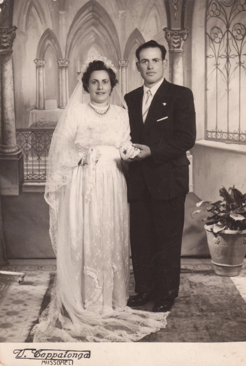 During a recent holiday, I was finding photos to preserve for personal family reasons and found this. I believe it was once owned by my wife's mother. Wedding postcard of Mr. and Mrs. Antonio Petruzella taken February 20, 1955 in Alabama (probably Birmingham). Most likely related to my mother-in-law, as her mother's last name was Petruzella. Probably a cousin. Photographer listed as V. Cappalonga but no longer in business. View full size.
