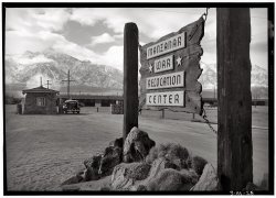 1943. Entrance to the Manzanar Relocation Center, 230 miles north of Los Angeles. View full size. Photograph by Ansel Adams.