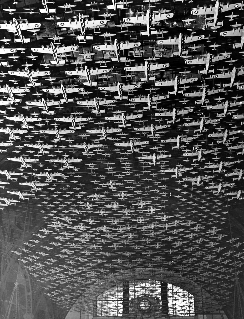 Model airplanes decorate the ceiling of the train concourses at Union Station in Chicago, Illinois. Jack Delano, 1943. View full size.