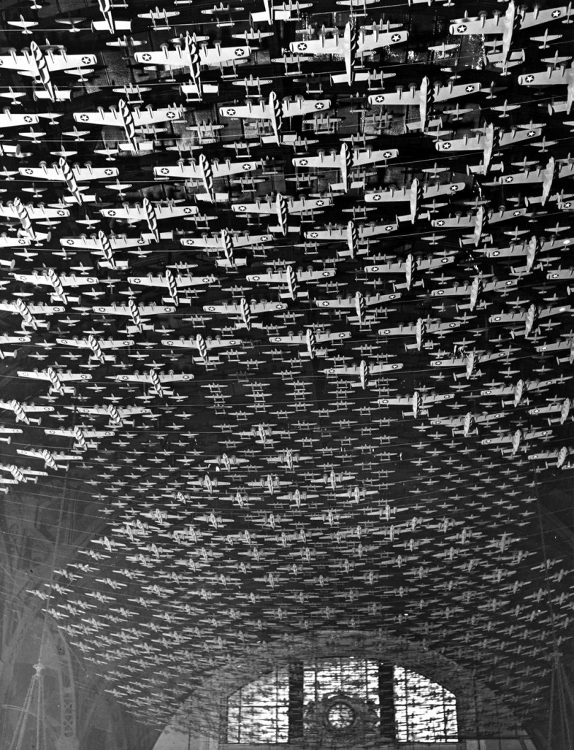 Model airplanes decorate the ceiling of the train concourses at Union Station in Chicago, Illinois. Jack Delano, 1943. View full size.
