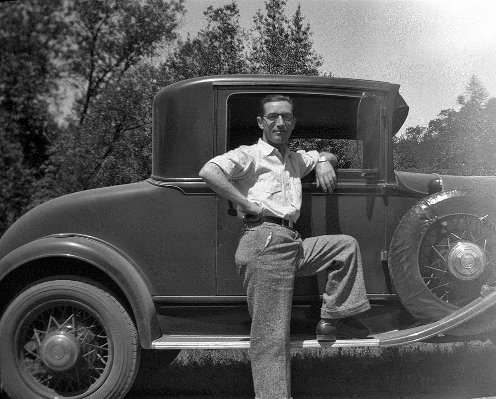 His Chrysler. Not sure of the year, but probably a 1930 or 1931. The film fell victim to light fogging, unfortunately, thus no front. Taken by my mother on their honeymoon, October 1932. 

She was prone to making occasional remarks about him going out and buying a new car "as soon as he got some money in his pocket." But in truth, over the course of a driving career of nearly six decades, my father bought just five; after this Chrysler was a Plymouth around 1934, a Hudson in 1948 and Ramblers in 1956 and 1966. Not the kind of frequency that would have the automobile industry doing cartwheels, I suspect.

No doubt about it, though, the driver's seat was Father's exclusive domain. After an ill-fated attempt early on to teach Mother how to drive, the matter was laid to rest. None of us three kids learned how until adulthood, and then via driving schools. View full size.