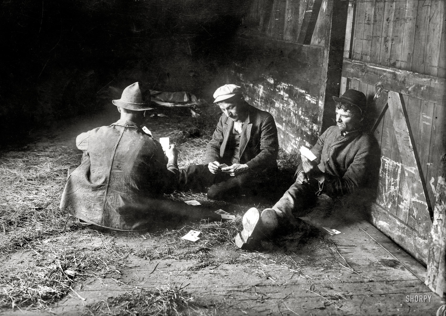 Location unknown circa 1915. "Tramps in boxcar playing cards." 5x7 glass negative, George Grantham Bain Collection. View full size.