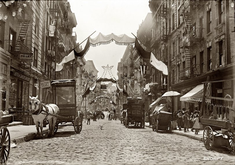 New York, May 16, 1908. "Italian festa. Mott Street decorated for religious feast." View full size. At left is a section of street seen in this post a few days ago. Google Street View. To the left of the white horse, 166 Mott (Buffa &amp; Cianciosi) is now Ken Mable Inc.  5x7 glass negative, George Grantham Bain Collection.
