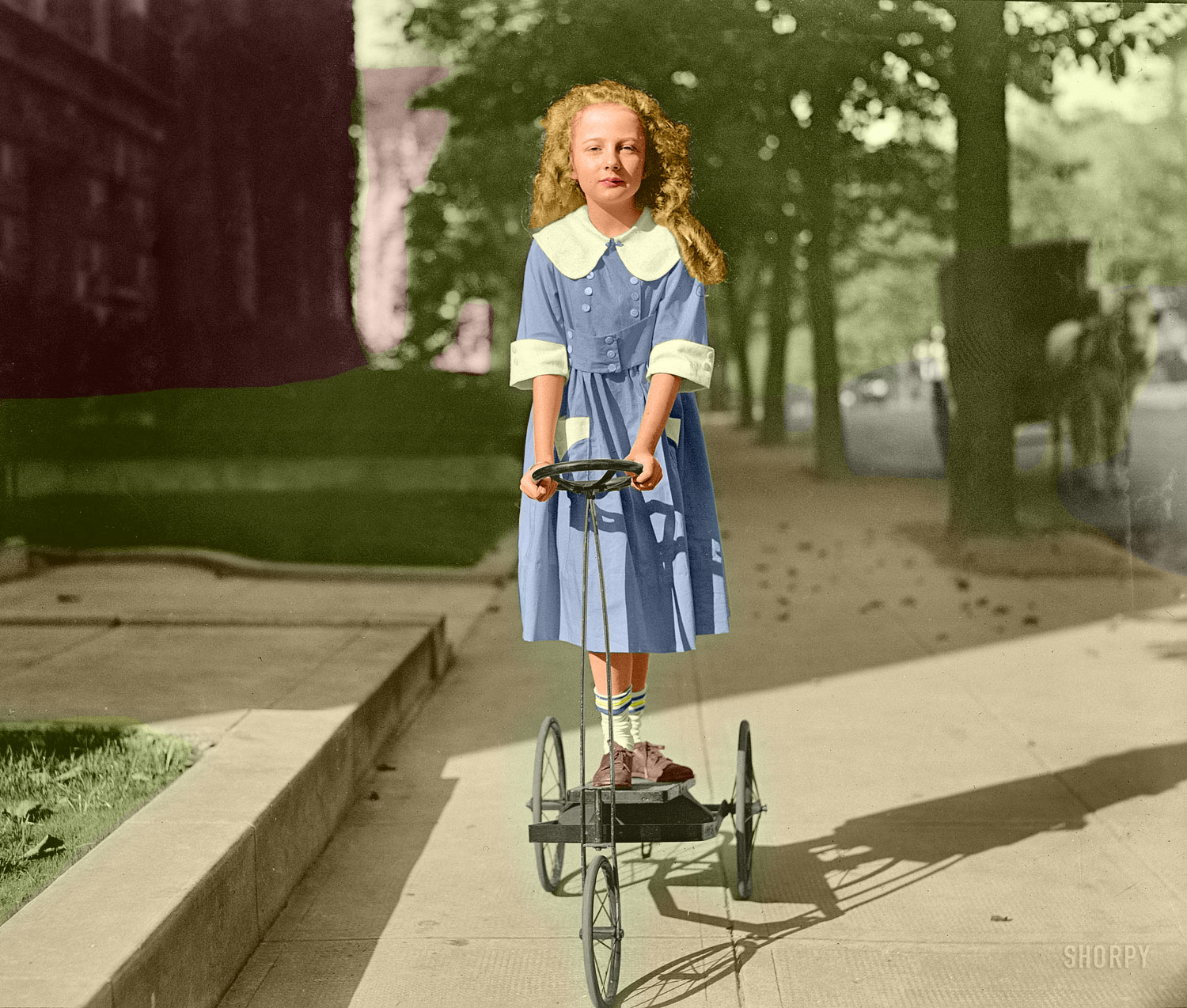 This is a colorized version of Mary Dixon Palmer: 1920.  It looks like this outlandishly dangerous-looking device had a treadle instead of pedals. View full size.