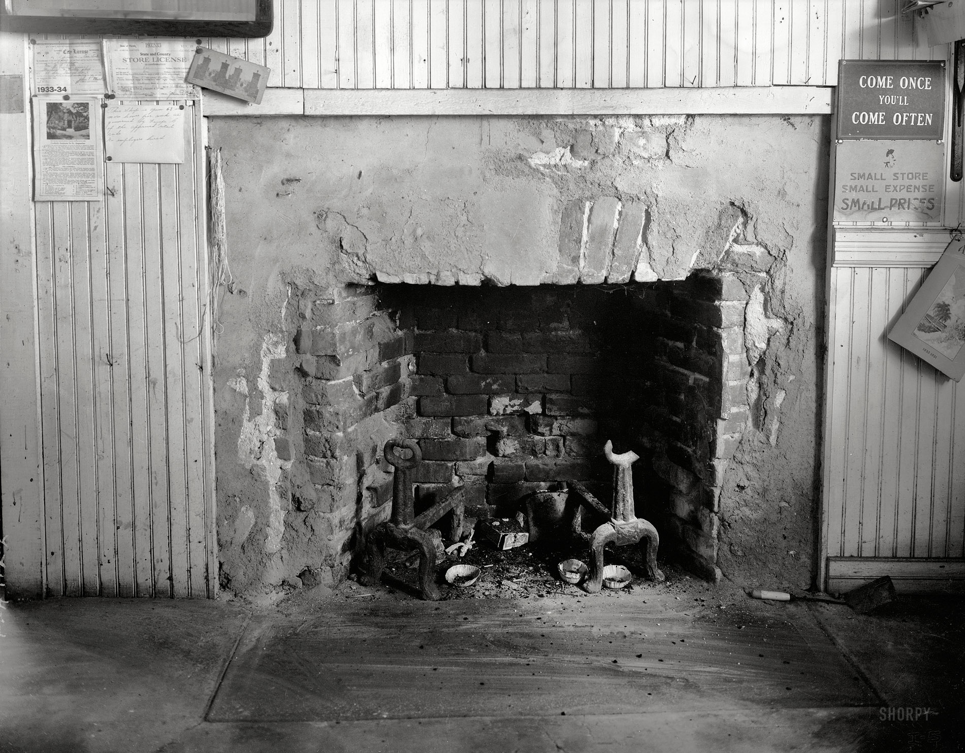 Florida circa 1937. "Old Spanish Inn, 43 George Street, St. Augustine. Dr. Chatelain's photographs. P.A. Wolfe, photographer." Fireplace in the "Grass Novelty Shop" of the Old Spanish Inn, also known as the De Mesa-Sanchez House. Acetate negative, Frances Benjamin Johnston collection.  View full size.