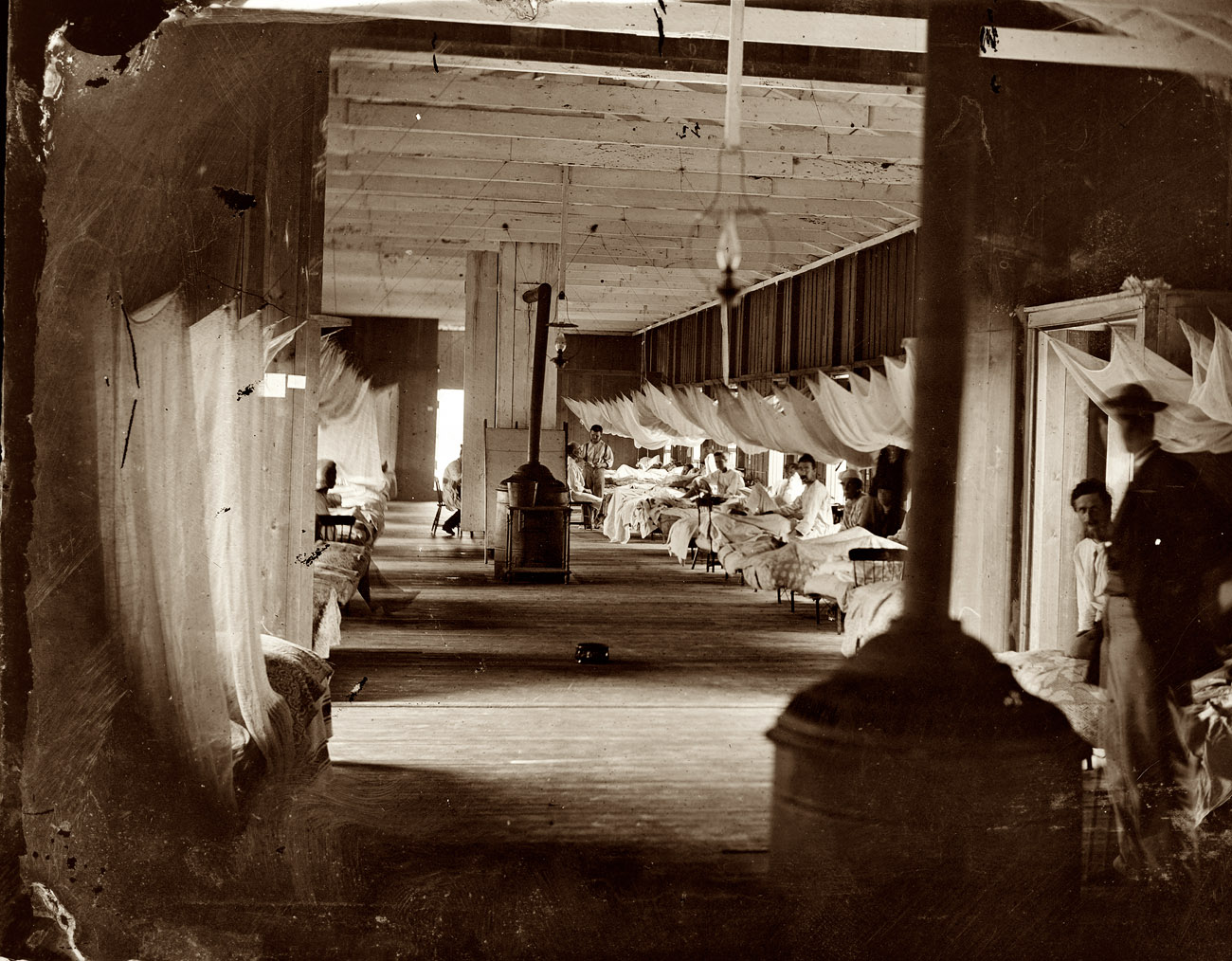 Washington circa 1863. Wounded soldiers at Harewood Hospital with mosquito netting over their beds. View full size. Left half of a glass-plate stereograph.