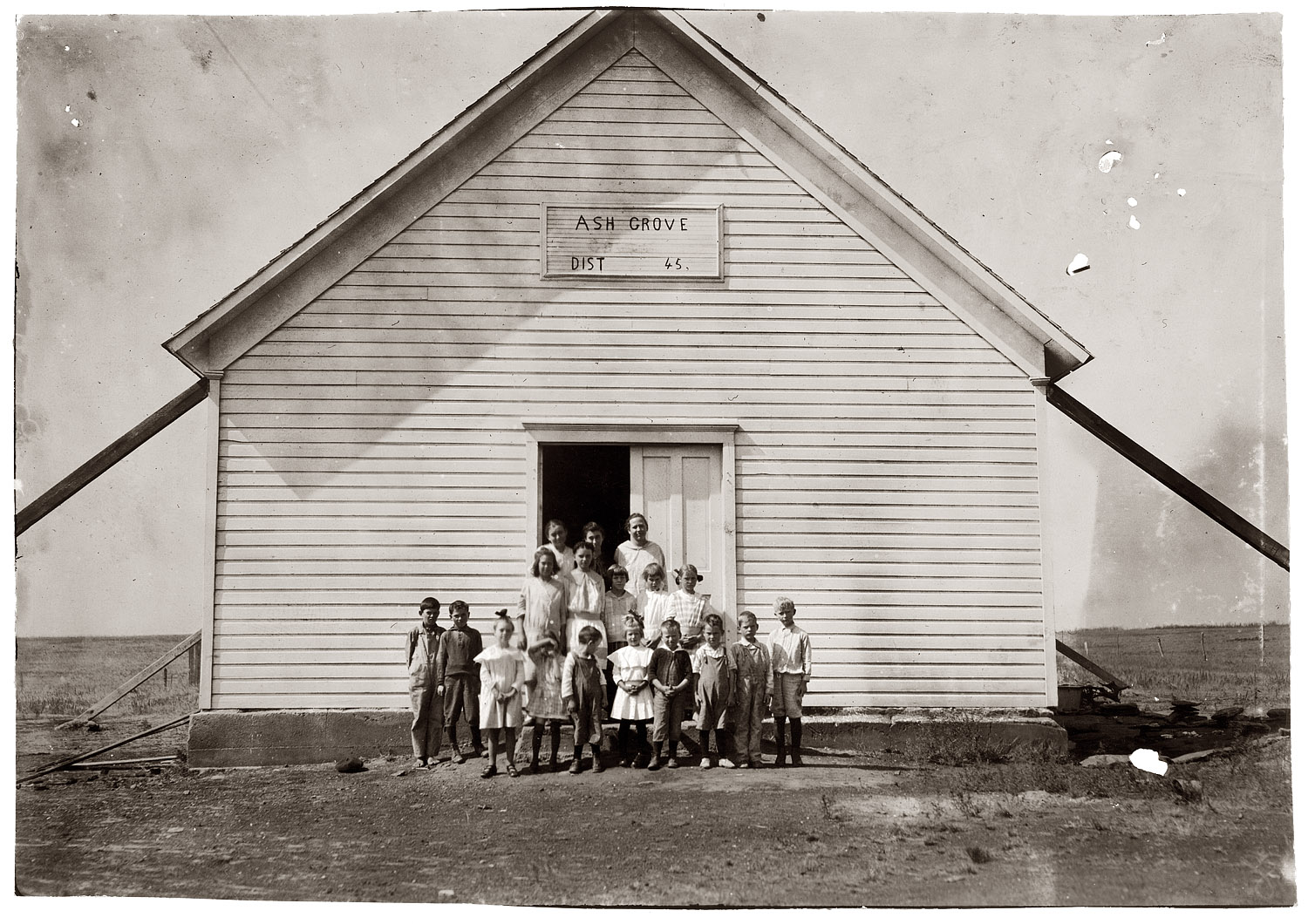 Oct. 10, 1916. Comanche County, Oklahoma. "School #45, Ash Grove; Miss Hazel McKay, Teacher. One-room school in fair condition. Opened Sept. 4 for 8 month term. Enrollment 22, average attendance 15; last year: enrollment 27, average attendance 15. The balance are picking cotton and also five more that have not enrolled at all. Pickers may be out two weeks more. Teacher expects 30 enrolled after picking is over." View full size. Photo and caption by Lewis Wickes Hine.