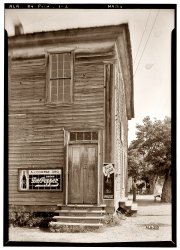 "Old Store." April 13, 1937. A.J. Coleman Grocery at State Highways 14 and 86 in Pickensville, Alabama. South elevation showing door. View full size. Photograph by Alex Bush for the Historic American Buildings Survey.