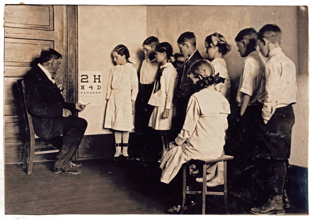 Children in Grade 5 of Washington School in Lawton, Oklahoma participate in a Medical inspection. Photograph by Lewis Wickes Hine, 1917. / Lewis W. Hine. View full size.