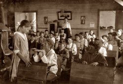 April 1917. "Daily inspection of teeth and fingernails. Older pupils make the inspection under the direction of teacher who records results. This has been done every day this year. School #49, Comanche County, Oklahoma (near Lawton)." View full size. Photograph by Lewis Wickes Hine. Alternate version here.