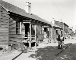 Savannah, Georgia, circa 1939. "Fahm Street, west side. Row houses built about 1850. Torn down 1940 for Yamacraw Village housing." You can't stop progress. 8x10 inch acetate negative by Frances Benjamin Johnston. View full size.