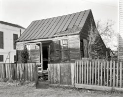 Savannah, Georgia, circa 1939. "Old house on Fahm Street, West Side." 8x10 inch safety negative by Frances Benjamin Johnston. View full size.