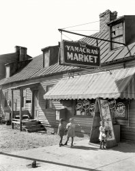 Savannah, Georgia, circa 1939. "Yamacraw Market, Fahm Street. Rowhouse structure built about 1850. Torn down 1940 for Yamacraw Village Housing Projects." 8x10 acetate negative by Frances Benjamin Johnston. View full size.