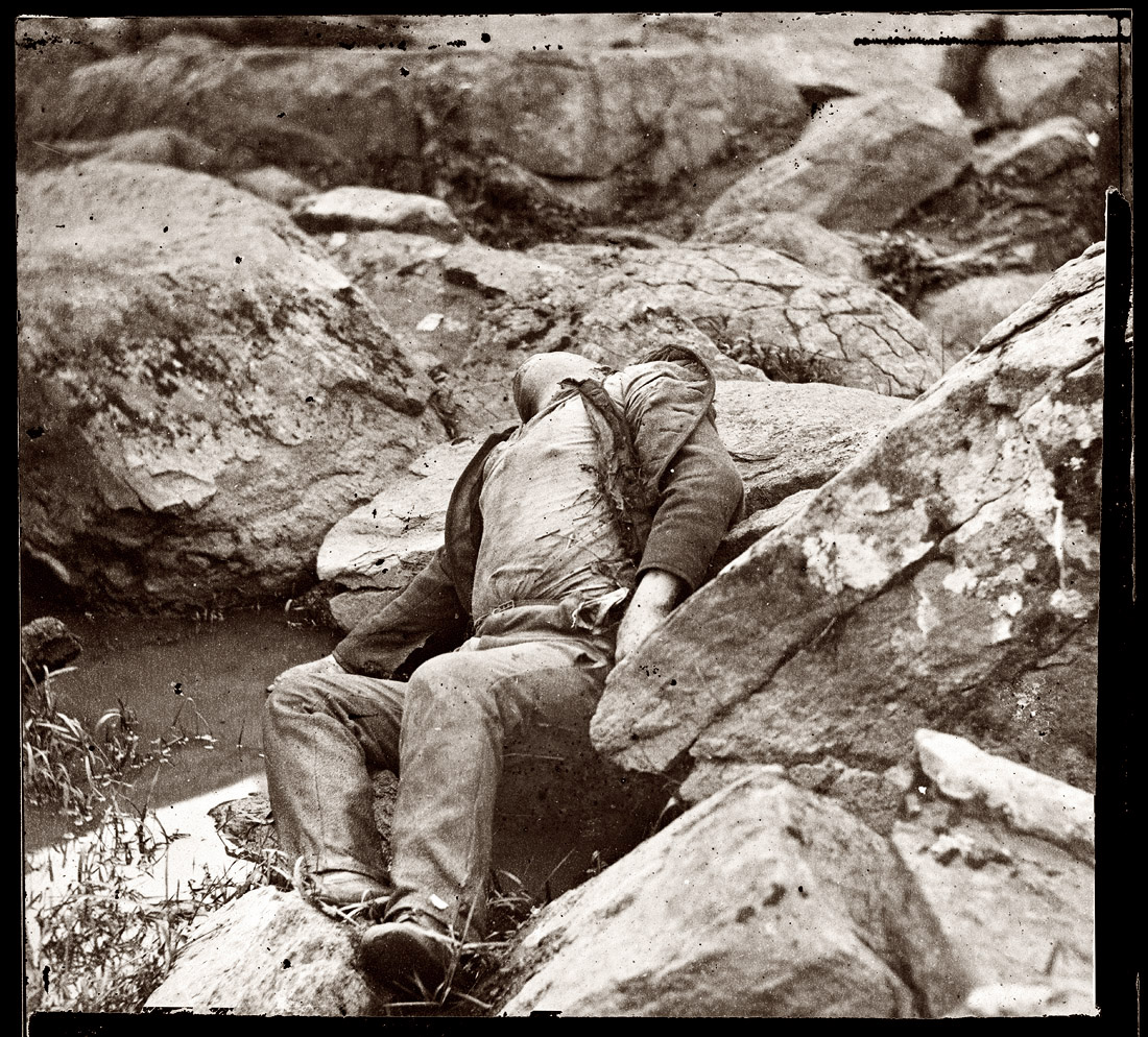 July 1863. Dead Confederate sharpshooter at the foot of Round Top. Gettysburg, Pennsylvania. View full size. Photograph by Alexander Gardner.