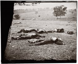Federal soldiers killed July 1, 1863, near the McPherson woods. Gettysburg, Pennsylvania. View full size. Wet collodion glass plate, half of stereograph pair. Photograph by Timothy H. O'Sullivan.