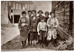 August 1911, Eastport, Maine. All these boys are cutters in the Seacoast Canning Co., Factory #7. Ages range from 7 to 12. Seven year old boy in front, Byron Hamilton, has a badly cut finger, but helps his brother regularly. Behind him is his brother George, 11 years. He cut his finger half off while working. They and many other youngsters said they were always cutting their fingers. George earns $1 some days, 75 cents usually. Some of the others said they earn $1 when they work all day. At times they start at 7 A.M. Work all day, and until midnight, but the work is very irregular. Names of those in the photo are George Mathews, Johnny Rust, John Surles, Fulsom McCutchin (11 yrs.), Albert Robinson, Morris McConnell. View full size. Photograph by Lewis Wickes Hine.