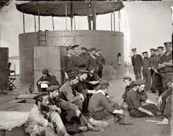 July 9, 1862. "James River, Virginia. Sailors relaxing on deck of the U.S.S. Monitor." From photographs of the Federal Navy and seaborne expeditions against the Atlantic Coast of the Confederacy, 1861-1865. View full size. Wet plate negative, left half of stereograph pair. Photograph by James F. Gibson.