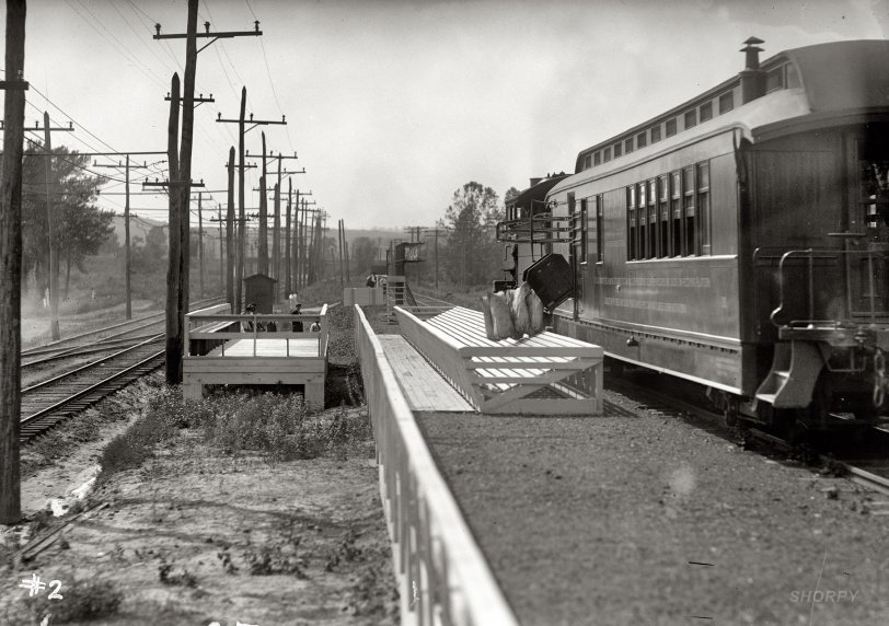 "Post Office Dept. Hupp Auto Railway Service." The download part of the Hupp mail-transfer system. Harris &amp; Ewing Collection glass negative. View full size.
