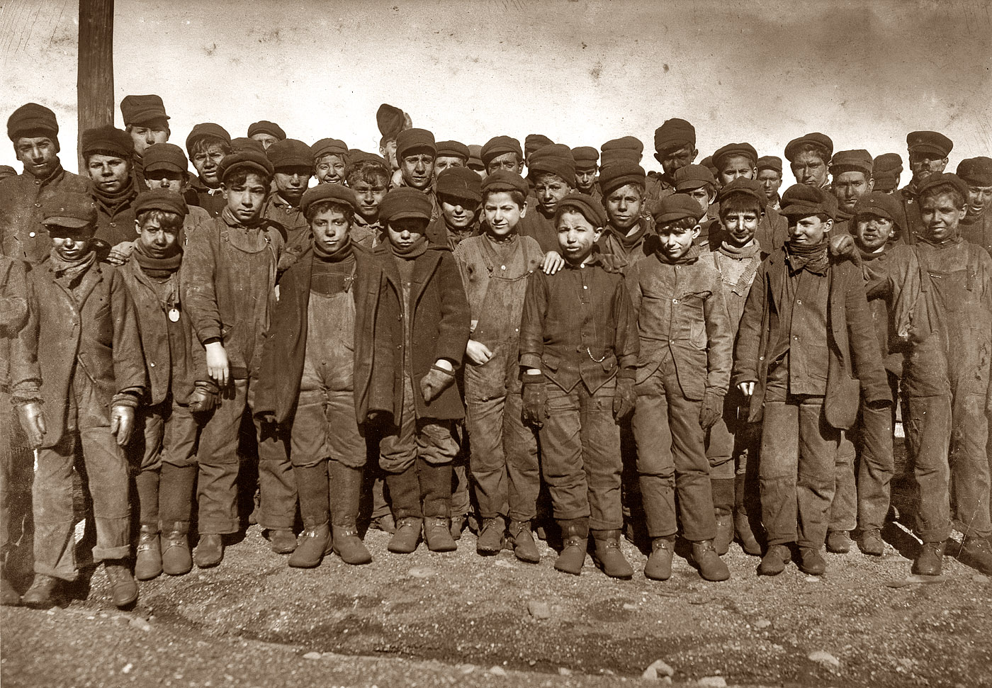 January 1911. Boys working in the #9 breaker of the Pennsylvania Coal Co. mine at Hughestown Borough near Pittston, Pennsylvania. In this group are Sam Belloma of Pine Street and Angelo Ross of 142 Panama Street. View full size.