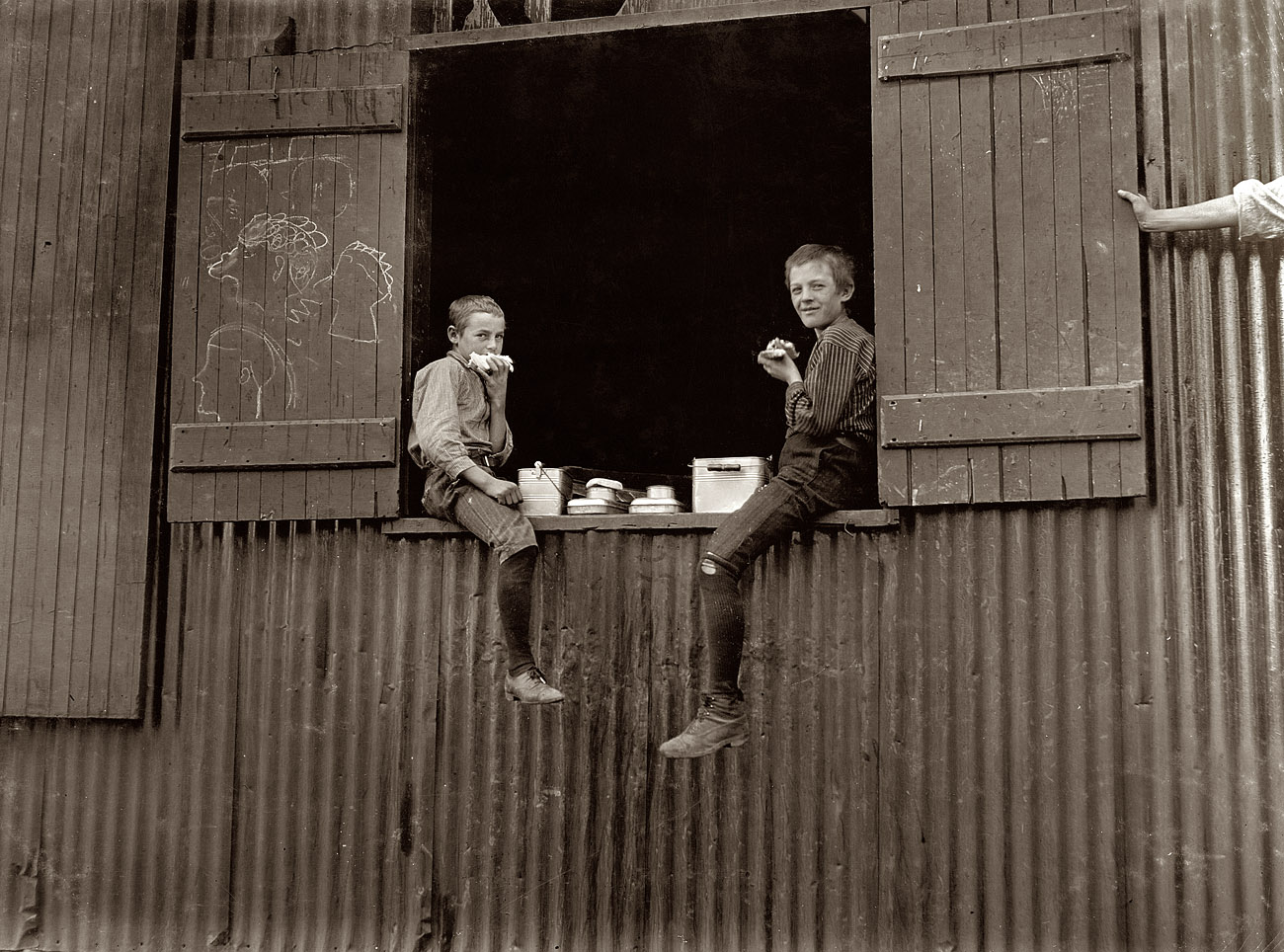 October 1908. "Lunch time at the Economy Glass Works in Morgantown, W. Va. Plenty more like this inside." View full size. Photograph by Lewis Wickes Hine.