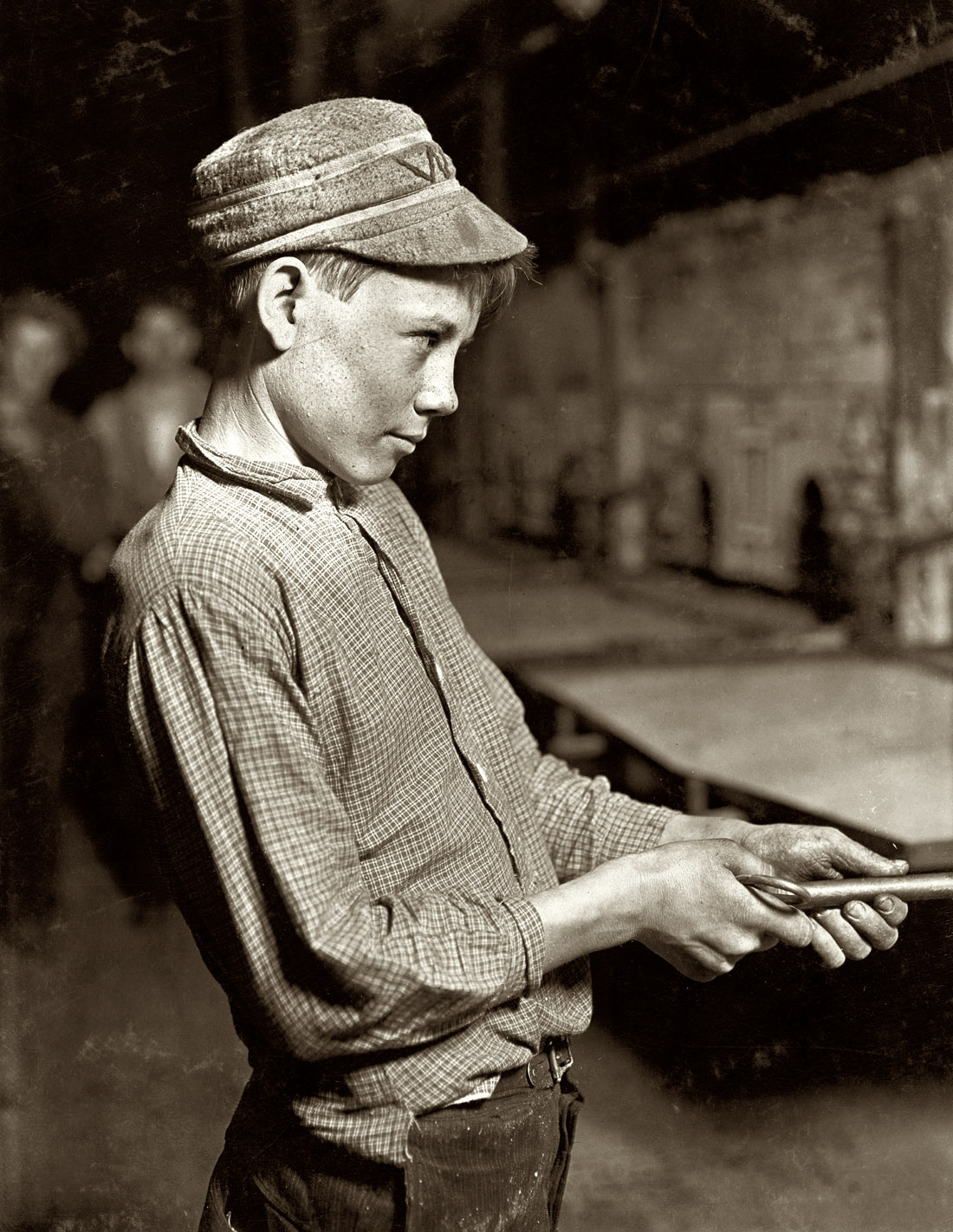 October 1908. Grafton, West Virginia. "Glassworks carrying-in boy at lehr (annealing furnace), fifteen years old. Has worked for several years. Works nine hours. Day shift one week, night shift next week. Gets $1.25 per day." Photograph and caption by Lewis Wickes Hine. View full size. 