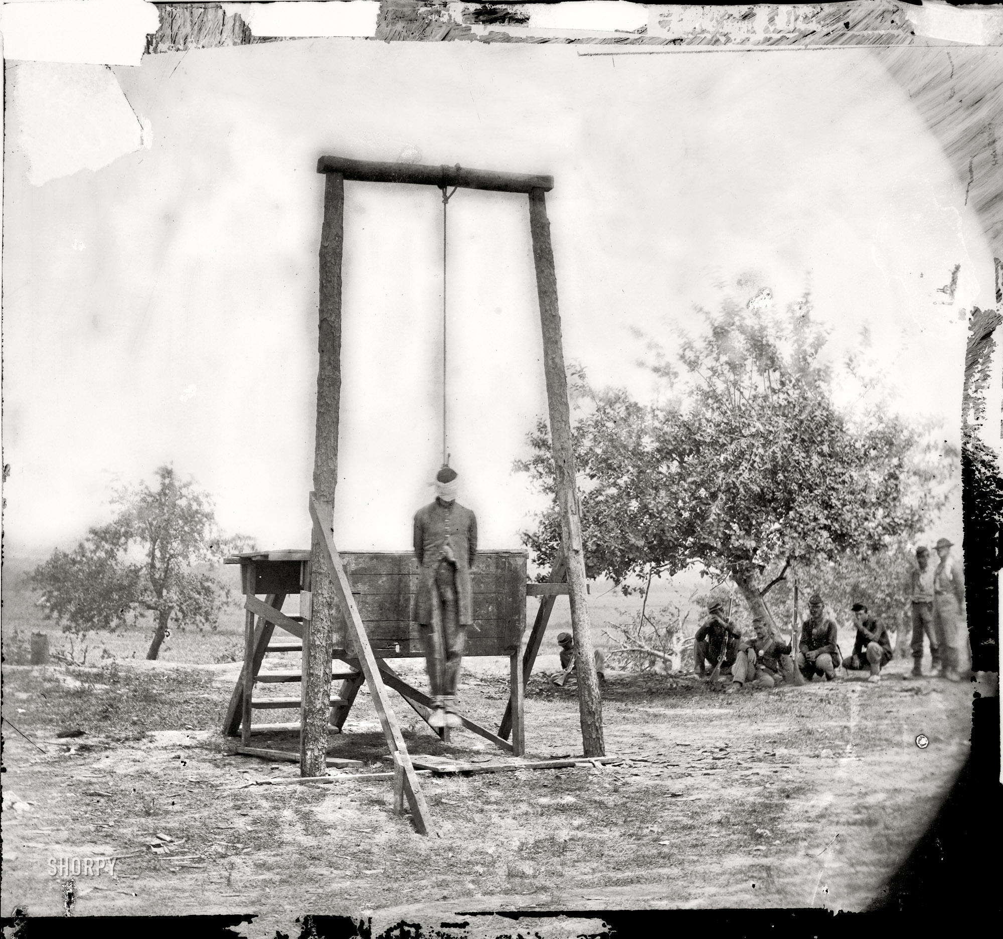 June 20, 1864. Petersburg, Virginia (vicinity) "The execution of Sergeant William Johnson, Negro soldier, at Jordan's farm. Hanged for Desertion and an Attempt to Outrage the Person of a Young Lady at the New-Kent Courthouse." (Supposedly he insulted a white woman and was made an example of to other soldiers who might be considering desertion; the outcome was not what the Federal Army had hoped for.) Wet plate glass negative by Timothy H. O'Sullivan. View full size.
