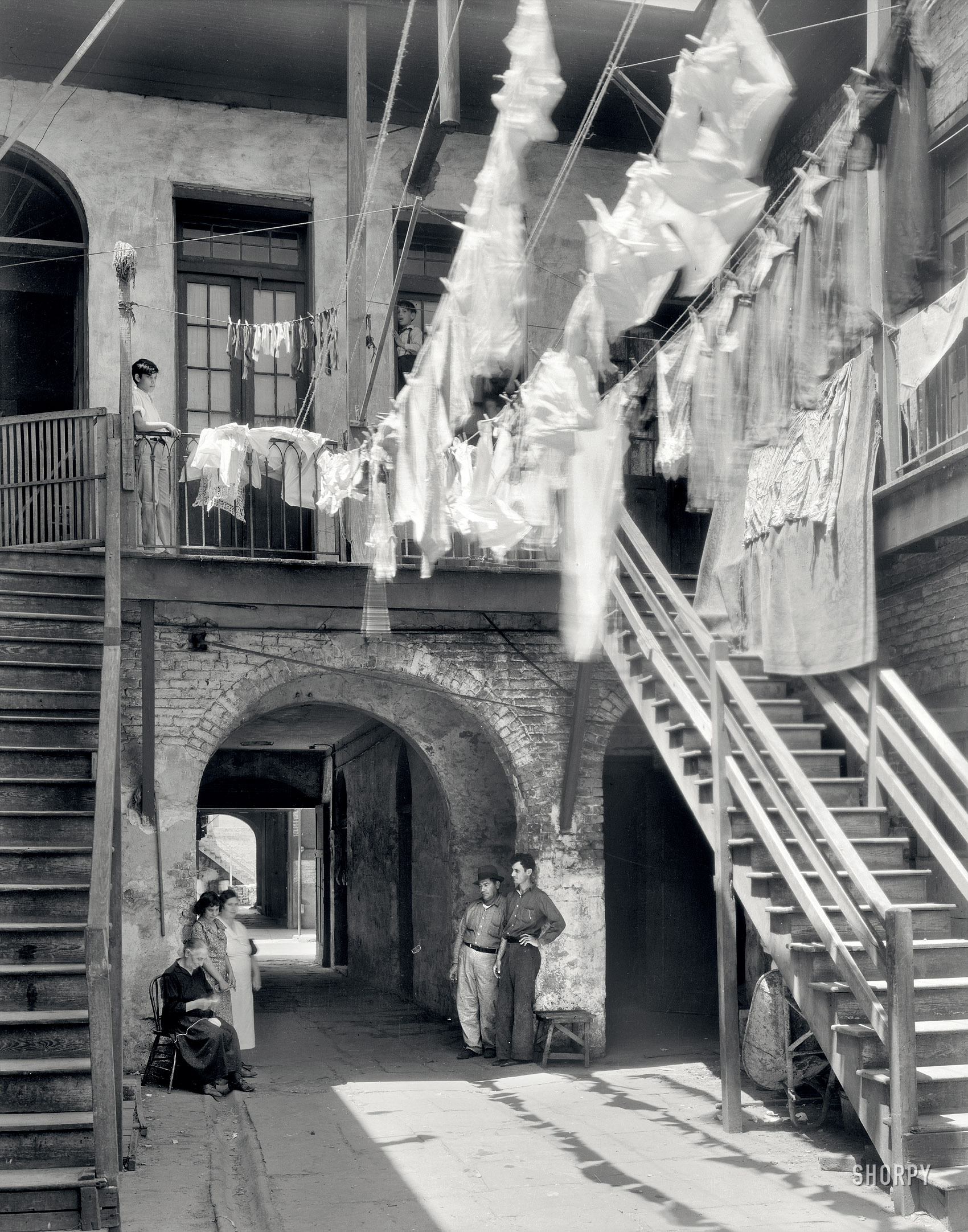 New Orleans circa 1937. "1133-1135 Chartres Street." Laundry day in the Quarter. 8x10 inch acetate negative by Frances Benjamin Johnston. View full size.