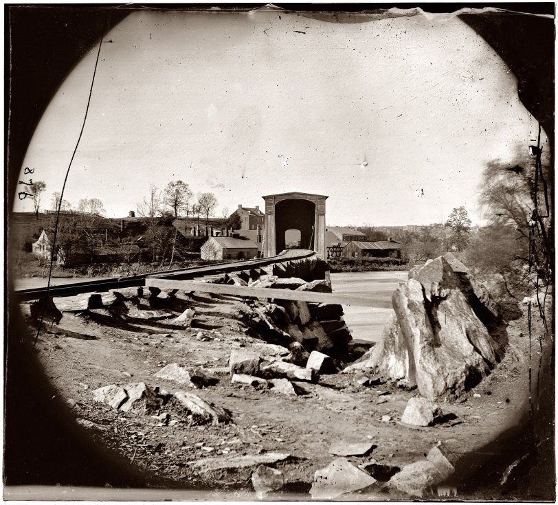Spring 1865. Belle Isle railroad bridge from the south bank of the James River after the fall of Richmond. View full size. Glass plate negative from the Civil War collection compiled by Hirst D. Milhollen and Donald H. Mugridge.
