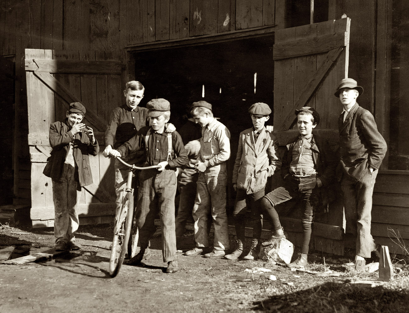November 1909. Woodbury, New Jersey. "Woodbury Bottle Works. Noon hour. All are workers." View full size. Photograph by Lewis Wickes Hine.