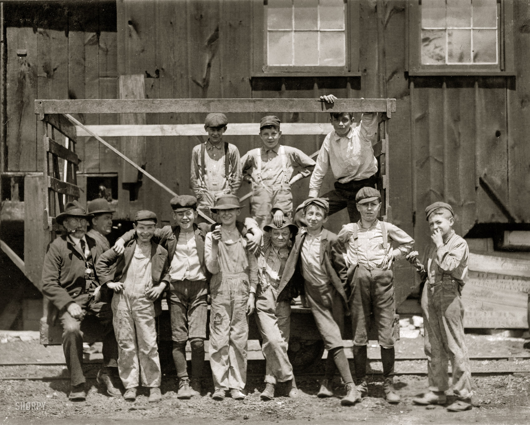 May 17, 1910. Alton, Illinois, "Noon hour. These boys are all working in the Illinois Glass Company. Smallest boy, Frank Dwyer, 1009½ E. Sixth Street, says he has been working here three months. Joe Dwyer (brother) has been working here over two years. Henry Maul, 513 Central Avenue. Frank Schenk, lives with uncle, 611 Central Avenue. Emil Ohley, 1012 E. Sixth Street. William Jarett, 825 E. Fifth Street. Fred Metz, 707 Bloomfield Street. In addition to their telling me they worked, I saw them beginning work just before 1 p.m. Photo at 12:30." Photograph and caption by Lewis Wickes Hine. View full size.