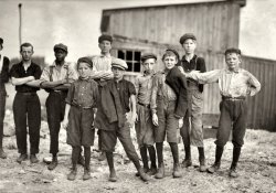 June 1911. Alexandria, Virginia. "Old Dominion Glass Co. A few of the young boys working on the night shift at the Alexandria glass factory. Negroes work side by side with the white workers." Photograph by Lewis Wickes Hine. View full size.