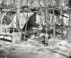 August 1864. "Petersburg, Virginia. Federal soldier's quarters." A glimpse of camp life. Wet plate glass negative by Timothy H. O'Sullivan. View full size.