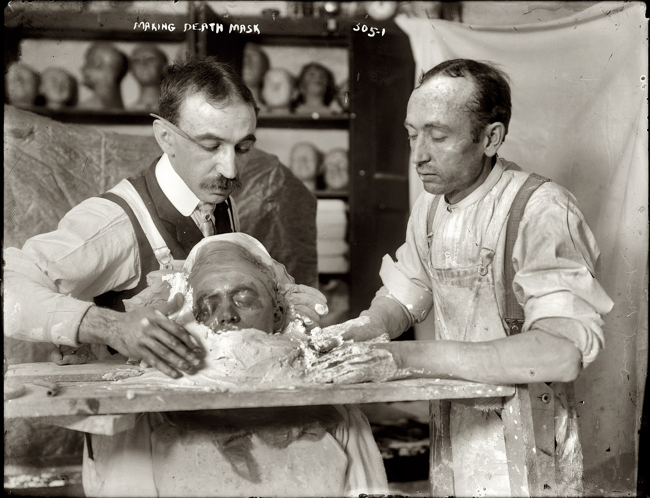 New York circa 1908. Making a plaster death mask. View full size. 8x10 glass negative, George Grantham Bain Collection, Library of Congress.