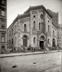 New York, 1908. "Old church on 48th Street." Studebaker Garage, a former Christian Science house of worship, at 143 West 48th Street. View full size. 8x10 glass negative, George Grantham Bain Collection, Library of Congress.
Studebaker CathedralAcross the street: The Marmon Tabernacle.
Hail, Taxi!And they said America worships the automobile. Well, this'll show'em.
Garage?Could someone explain why this building is called a garage?
[Because that's what it is. - Dave]
Garage noun A shelter or repair shop for automotive vehicles.
Garage? (Again)Doesn't anybody read the captions before sending questions?
[The giant STUDEBAKER GARAGE sign would also be a clue. - Dave]
Adaptive ReuseI found this photograph a bit shocking at first glance.  The collision of the sacred and profane, if you will. I wonder if folks felt a bit put-off by it at the time?  I can see the church name (or its ghost image) on the arch. Can someone tell us if this building still exists?
Studebaker GarageThe 1908 International Motor Cyclopaedia lists a Studebaker Garage at 48th and Broadway.
Netherland TheaterThis NY Times article from June 16, 1909, details plans to replace the church with a theater. The church was at 137-143 West 48th Street between Sixth and Seventh avenues, which is now the location of the 1221 Avenue of the Americas "Breezeway" and loading dock. Ironic that it's still kind of a garage.
William A. Brady was the backer, and Herbert L. May of Pittsburgh sold the property to a syndicate headed by A.C. Quarrier. The new theater was to be called The Netherland.

139 W 48th"From Abyssinian to Zion: A Guide to Manhattan's Houses of Worship" by David W. Dunlap lists the address of First Church of Christ, Scientist as 139 West 48th Street - the former All Souls Episcopal Church, a Romanesque-style church built in 1861. Just across the street from the Cort Theater today.
Ha!The Marmon Tabernacle! Good one, AT.
Denny Gill
Chugiak, Alaska
A two-way streetThe church my wife went to when she was growing up used to be a Studebaker dealership.  Turnabout happens, I guess!
Good jobFantastic collection, well done. 
BTW, I keep expecting to get to the full sized image by clicking on the smaller one... 
Oh, that's another thing: the size of the pictures. 99% of pictures on the web are way too small. Kudos for bucking that trend. 
Here at the Studebaker CathedralWe are the home of the first full-service drive-in church.
Our ushers will assist you upon entering.
Valve jobs are done in the in the organ loft while you wait.
Oil changes are done in the choir stalls.  Use the east aisle upon entering.
Alignments and brake jobs are performed in the cloister. 
Body repairs are done under the apse.
Tune-ups are done in the radiating chapels.
The Lady's Chapel is open during all business hours.
Our balcony contains thousands of repair parts for all makes and models.
Confessions heard while you wait.  No charge. 
Collections taken daily from 7:00 A.M. to 7:00 P.M.
"Drive in a wreck today!" (c)
Great pic!...RE: this siteThe Broadway theatre that replaced the site of the Studebaker/Cathedral was the Playhouse Theatre built in 1911 (info link below), which was torn down in 1969 to add to Rockefeller Center as an office building, after being used one last time for Mel Brooks' original film 'The Producers' for the Springtime for Hitler scenes...it was across the street from the Cort Theatre, which is still standing today &amp; currently playing 'Breakfast at Tiffany's'...
http://www.ibdb.com/venue.php?id=1324
(The Gallery, Cars, Trucks, Buses, G.G. Bain, NYC)