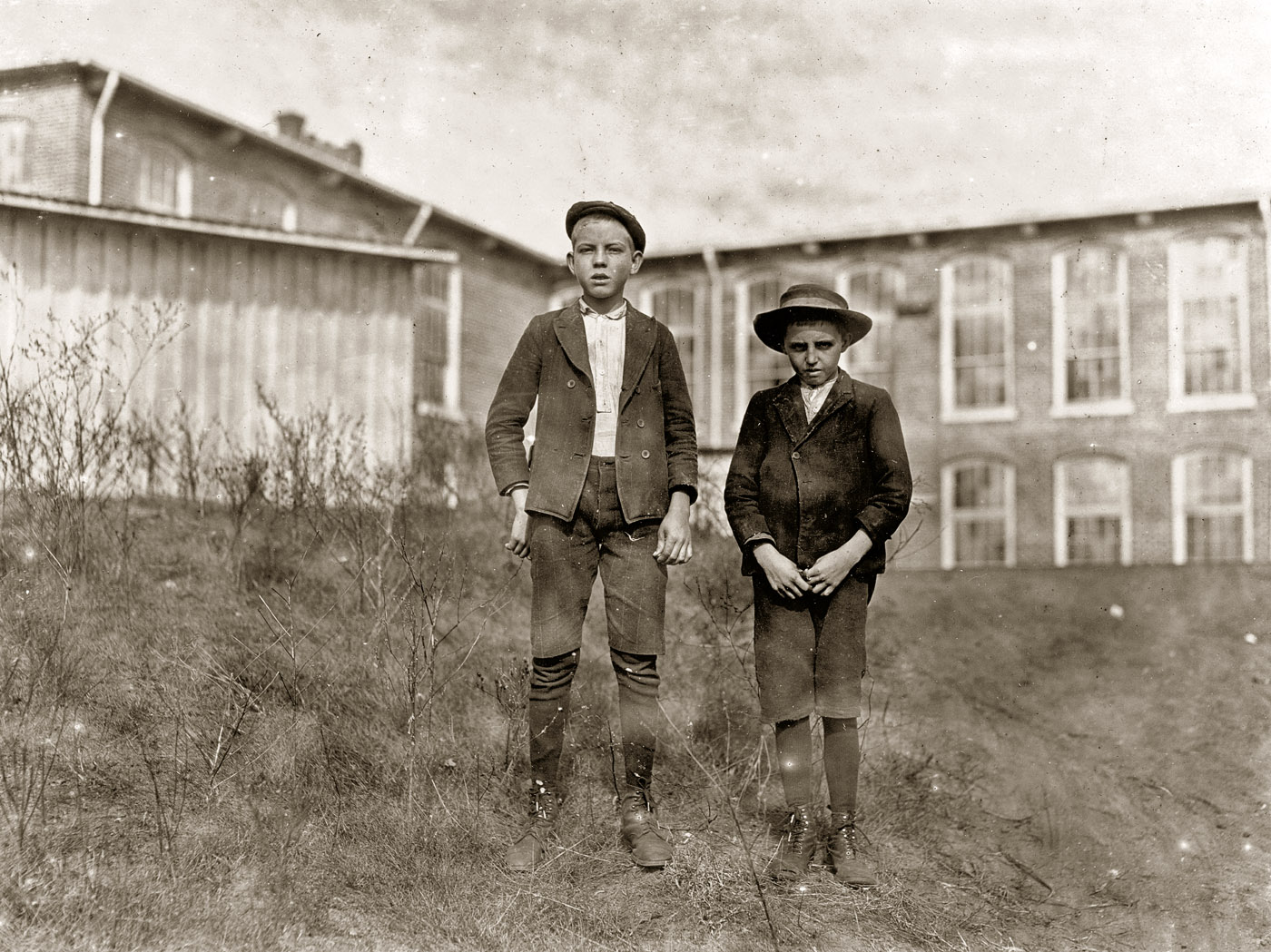 November 1908. Chester, South Carolina. Tommy Ashville (smaller boy), two years in Wylie Mill. "Specks I'm about 11." Arthur Shelly, eight years in mill, 14 years old. Other boys agreed he had been in mill eight years. Photograph and caption by Lewis Wickes Hine. View full size.