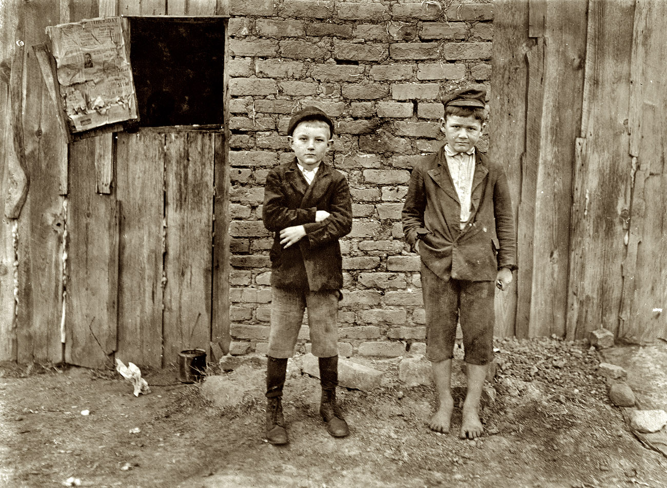 November 1908. Chester, South Carolina. "Eureka Cotton Mills. John Madison, 11 years old; 53 inches high. Beginning to sweep. Floyd Root, 10 years old. 50 inches high. Helps cousin spin every day after school. Witness: S.R. Hine." Photograph and caption by Lewis Wickes Hine. View full size.