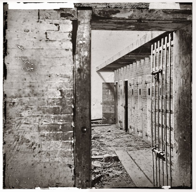 Interior view showing cells of Price, Birch & Co. slave pen at Alexandria, Virginia, circa 1865. Wet collodion, half of glass plate stereograph pair. View full size.