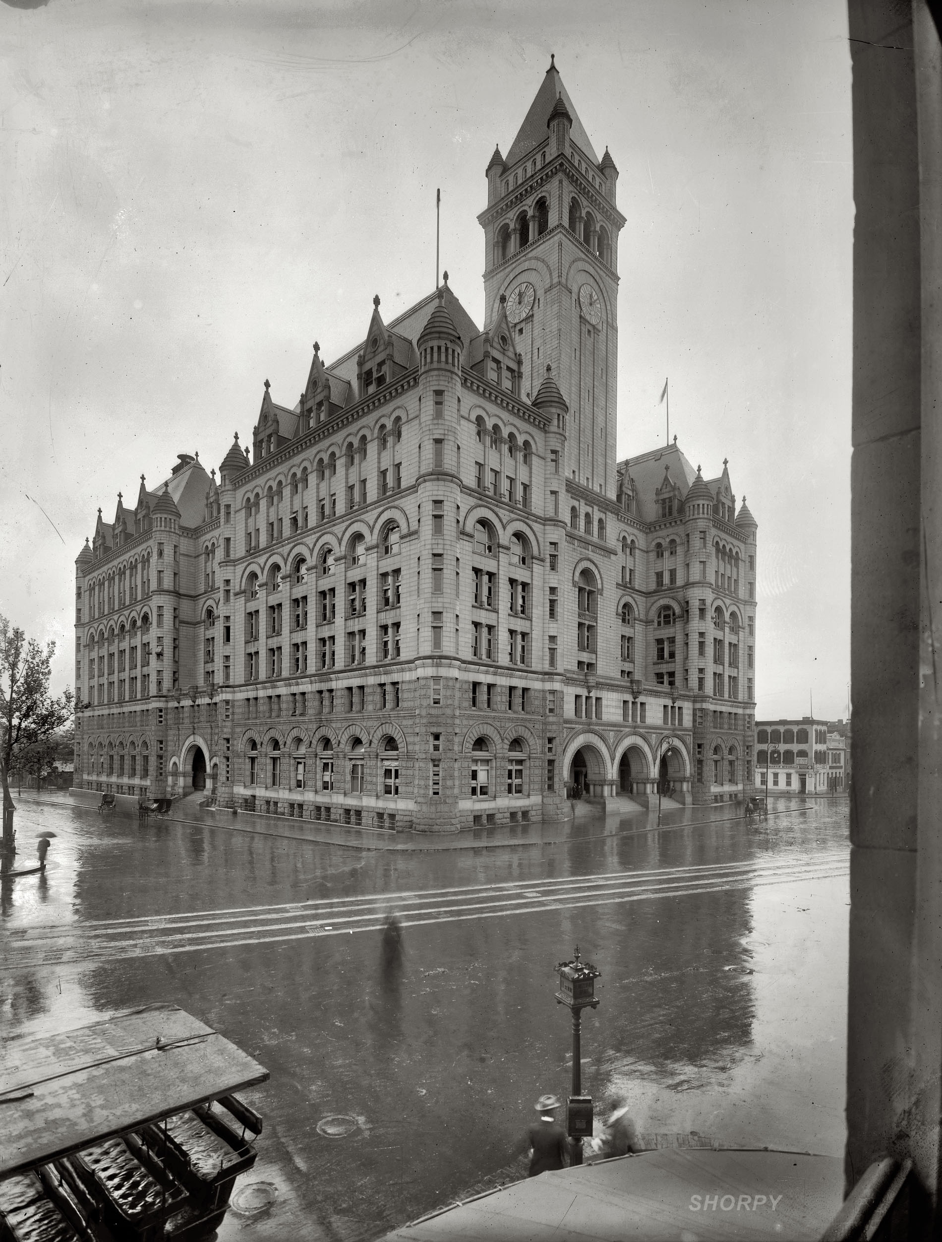 "Post Office Department, Washington," circa 1908. The Old Post Office building seen from the corner of 11th Street and Pennsylvania Avenue N.W. on a rainy day. George Grantham Bain Collection glass negative. View full size.