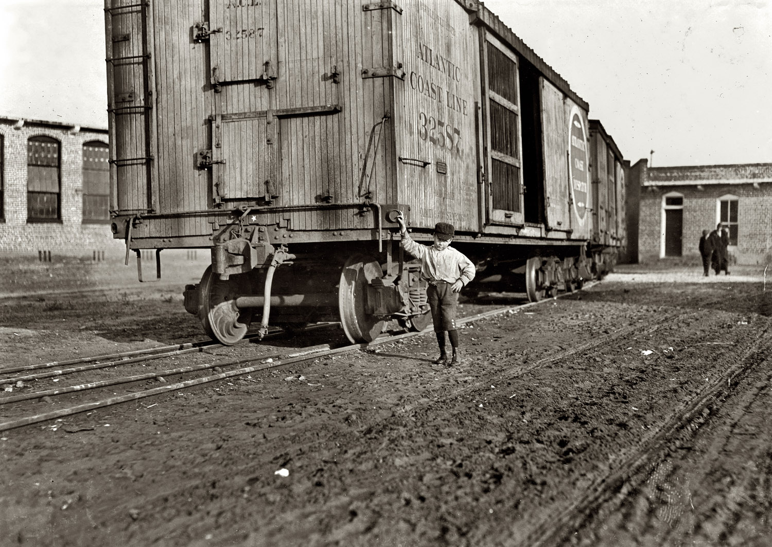 December 1908. Dillon, South Carolina. Johnnie, works at Maple Mills. 8 years old. Said "Ain't got no last name" when asked for it. Beginning to "help sister spin." View full size. Photograph and caption by Lewis Wickes Hine.