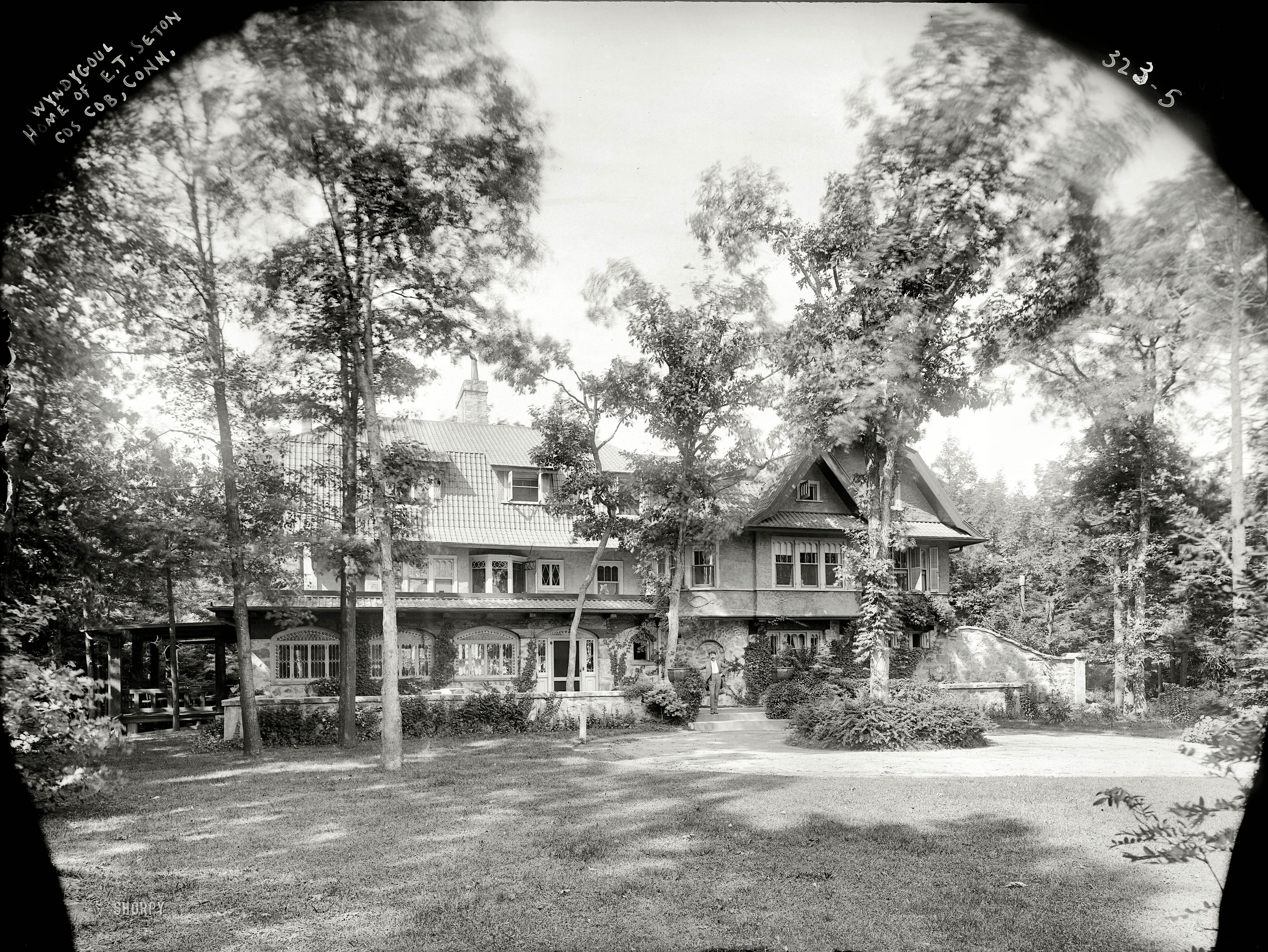 Circa 1908. "Wyndygoul, home of E.T. Seton." The writer-naturalist Ernest Thompson Seton, one of the founders of the Boy Scouts of America, at his Cos Cob, Connecticut, estate. 8x10 glass negative, Bain News Service. View full size.