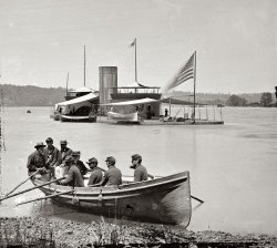 1864. "James River, Virginia. Double-turreted monitor U.S.S. Onondaga; soldiers in rowboat." From photographs of the Federal Navy and seaborne expeditions against the Atlantic Coast of the Confederacy, 1861-1865. View full size.