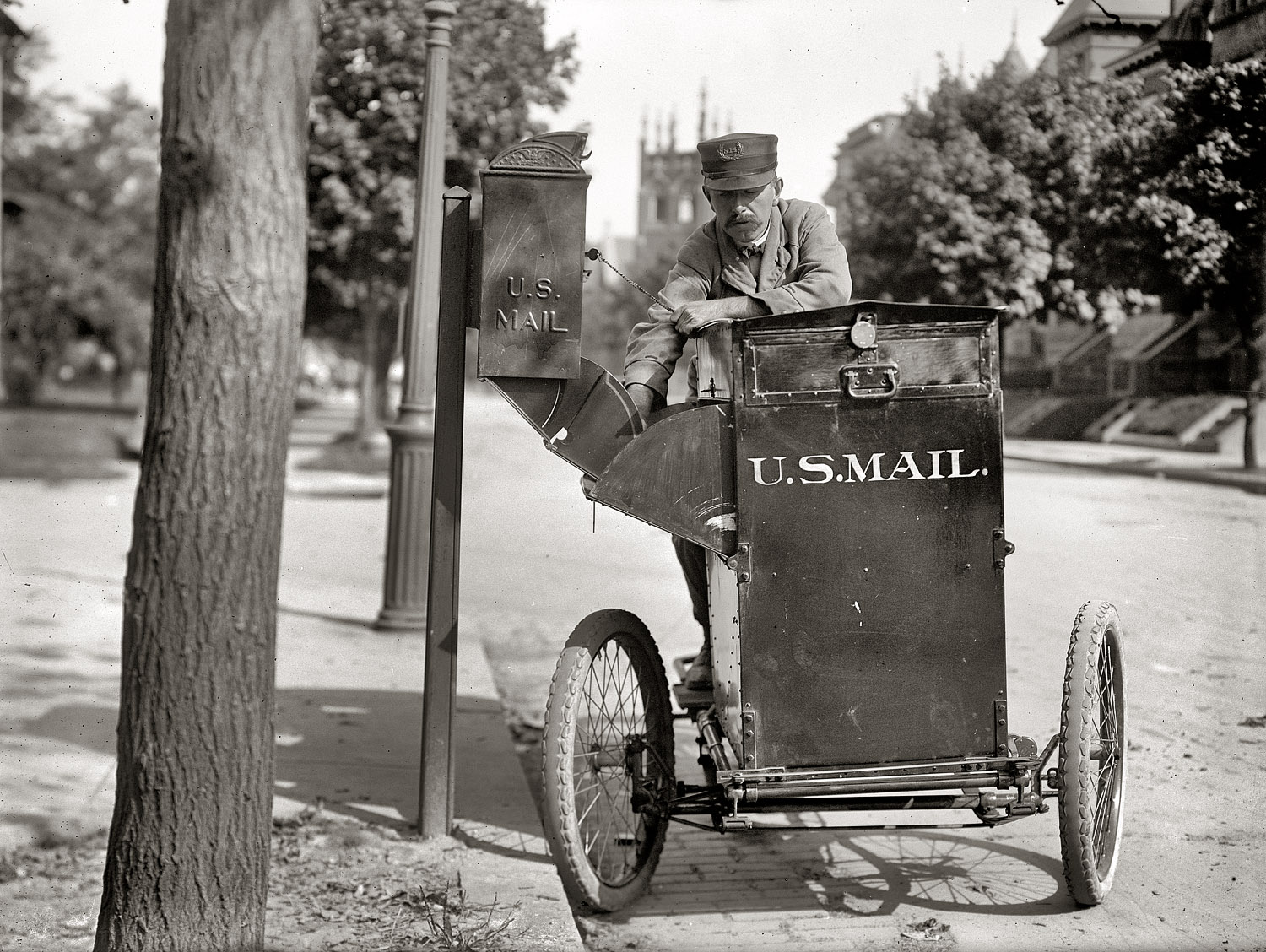 Washington, D.C. "Post Office Department. Motorcycle postman. 1912." S14 collects the mail. Harris & Ewing Collection glass negative. View full size.