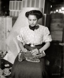 New York, 1908. "Stuffing a Teddy Bear." Our second photo illustrating this occupation. 8x10 glass negative, George Grantham Bain. View full size.
Lovely, Yet  Torn GirlShe has the face of a nice and obedient young girl.  She has the hairdo, clothing, and worn fingers of an older lady.  She has the fingernails (bitten short) of a person torn between having to live two lives.
(The Gallery, G.G. Bain, NYC)