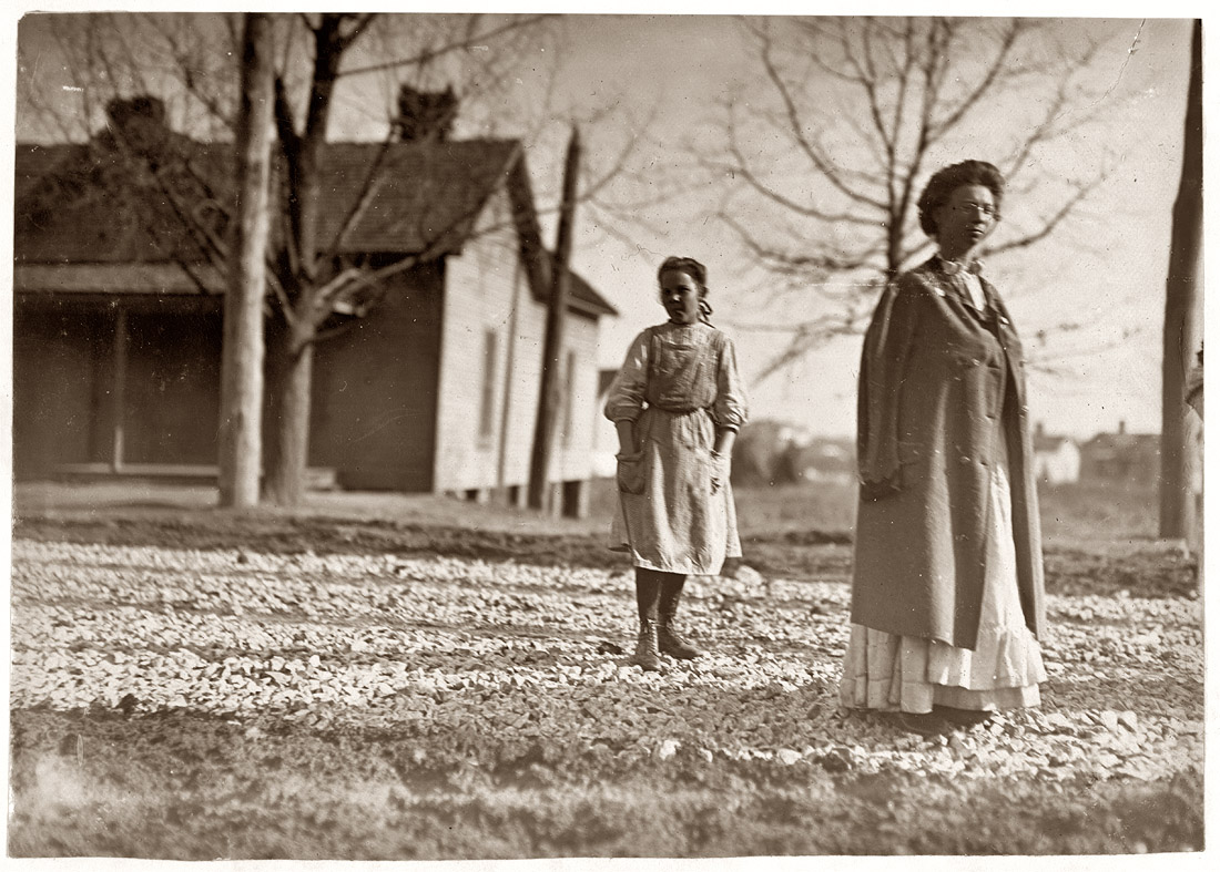 Small girl, Bright Horton, works in Atherton Mill, Charlotte, N.C. Been in mill work 2 years. January 1909. View full size. Photograph by Lewis Wickes Hine.