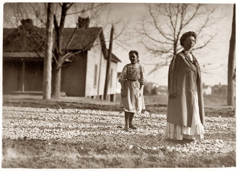 Photo of: Bright Horton: 1909 -- Small girl, Bright Horton, works in Atherton Mill, Charlotte, N.C. Been in mill work 2 years. January 1909. View full size. Photograph by Lewis Wickes Hine.